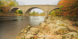 Historic stone bridge over river with autumn foliage – landscape photography digital download & UK wall art print