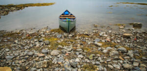 Canoe at Rest – Fine Art Shoreline Photography for Tranquil Wall Decor