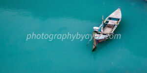 Solitary Drift – Fine Art Boat Photography for Tranquil Wall Decor